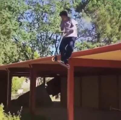 Kid jumps off roof with scooter, wins a couple booboos.