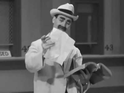 Groucho Marx gets conned out of his money by Chico with a Tutsi Frutsi Ice Cream cart, in their 1937 film 