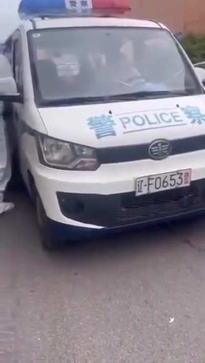 Chinese Police In Full 'Covid Suits' Using Duct Tape To Arrest A Man.