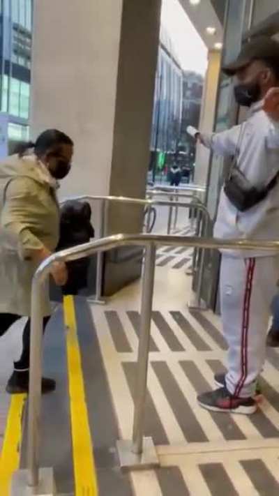 Guy runs a lint roller over random strangers