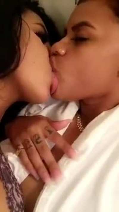 2 light skin girls making out.