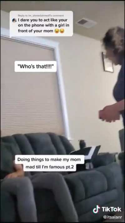 Pranking his mom.