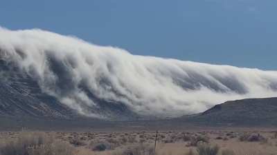 Cloud cascades seen tumbling over a mountain near Alkali Lake in Oregon.