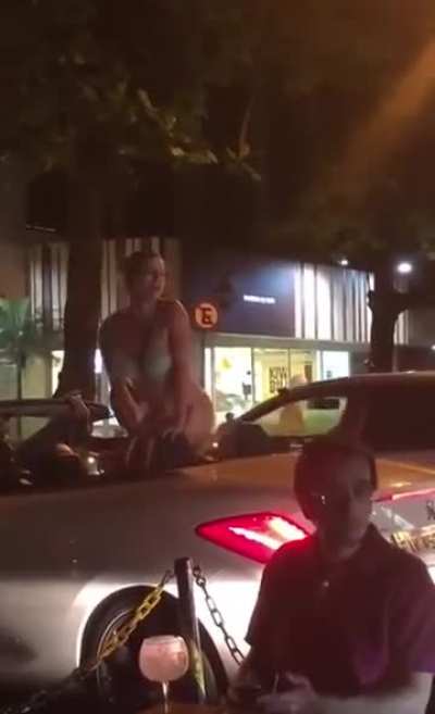 Throwing trash at a woman in a bikini