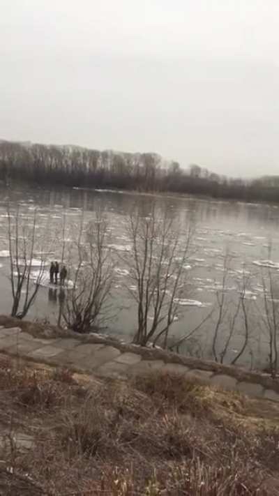 3 kids floating down a river on ice