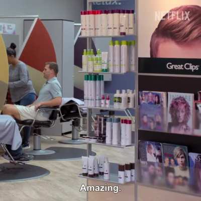 [Quarterback] Kirk Cousins uses his headshot for reference at the barbershop