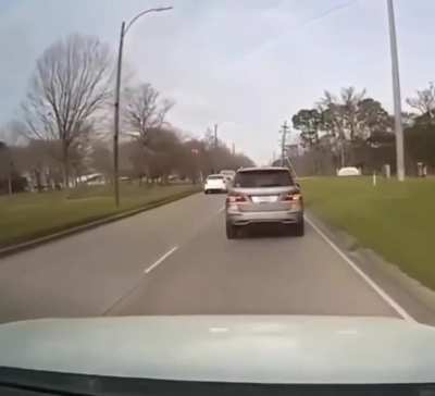 Stupid guy doesn't pay attention to the road