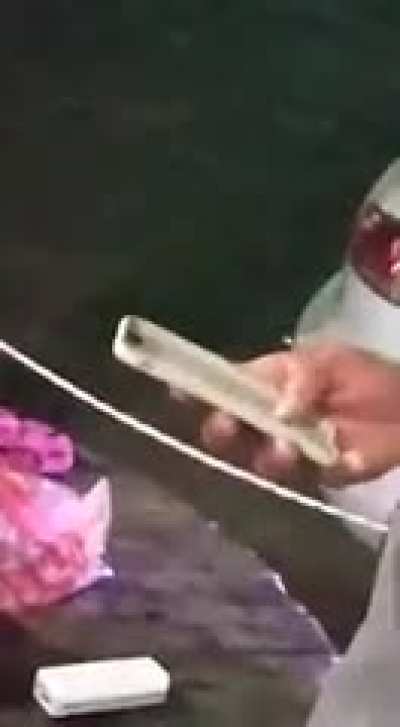 Man's trying to text.