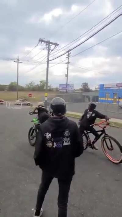 Little kid asks for ride his bike.