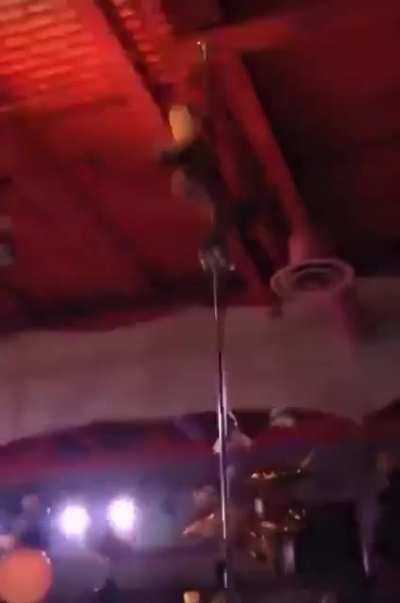 Girl falls off pole