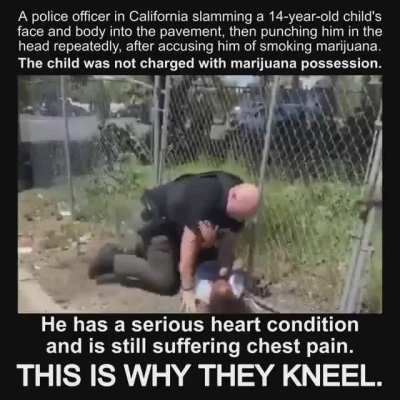 The police is slamming the young boy in the street with no reason