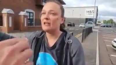 Irish woman confronts racists outside of hotel housing refugees.