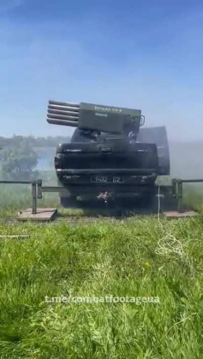 Ukrainian soldiers are firing at enemy positions from an 80mm Sivalka mini-multiple rocket launcher on a pickup truck.