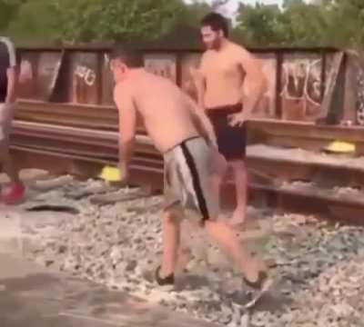 Guy tries to run and jump into a river but doesn’t see the boat until after he jumps, even though his friends try to warn him.