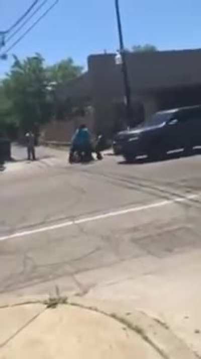 Latin kings protecting neighborhood from rioters.