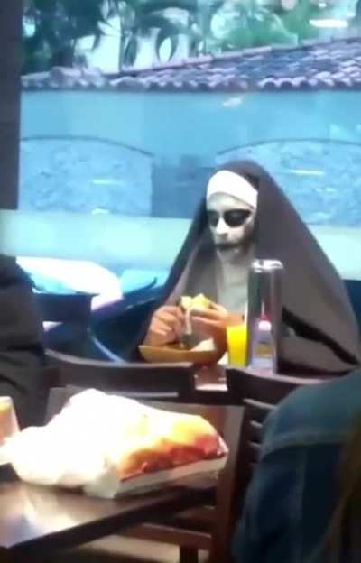 to take a sip of the juice while maintaining eye contact