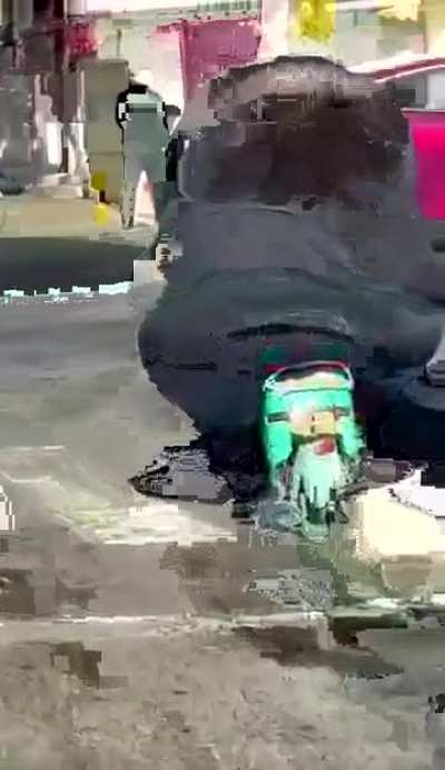 of a scooter and person