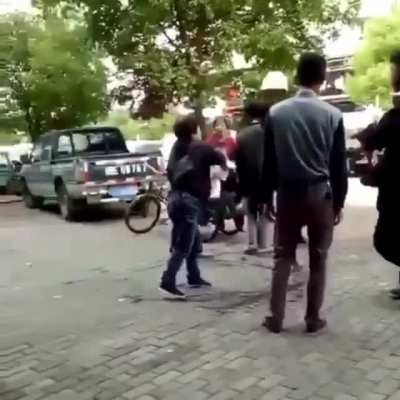 Women attacking workers