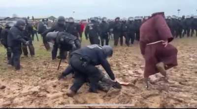 These German cops struggling for their lives against this Mud Wizard of some kind