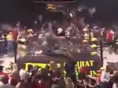 People throw chairs into ring