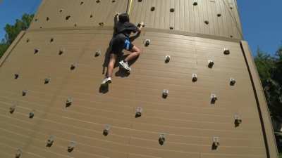 Rae rock climbing