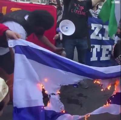 Israel flag burns in New York as peaceful protestors chant 