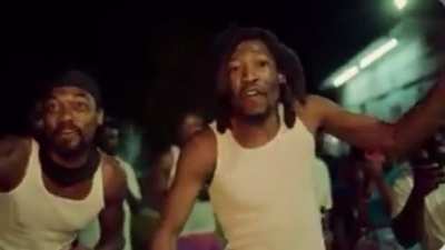 Who was the rapper at the end of the Lemme See music video ?