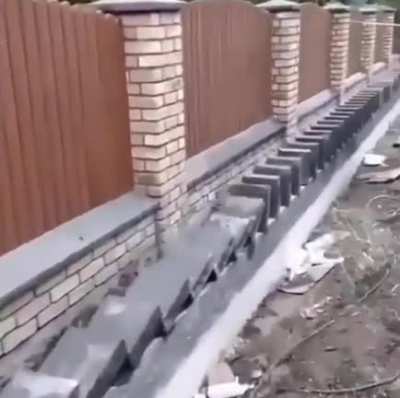 This man laying bricks