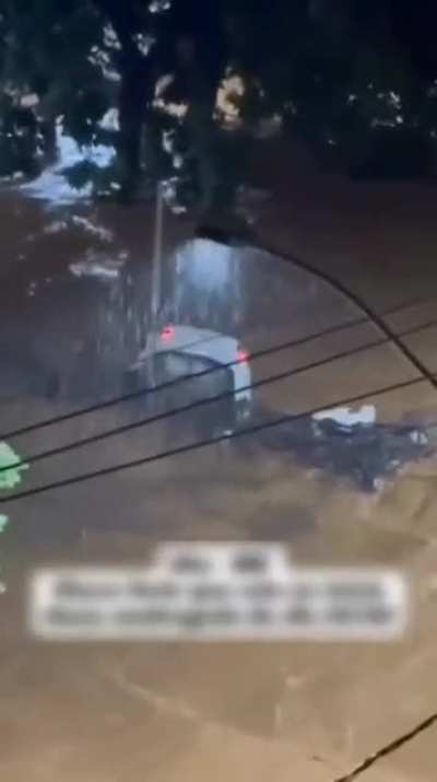 Uba Minas Gerais Brazil - 24 February 2026 - Floodwaters followed the Uba River overflow and vehicles were swept away
