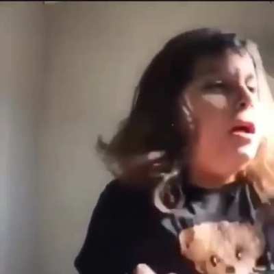 Trying to cut her own hair
