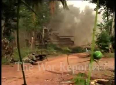 Sri Lankan 58th infantry regiment soliders protecting their tank from a ltte anti tank crew hidden in a house.(2005.12.17)