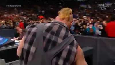 Brock Lesnar picks up a chair