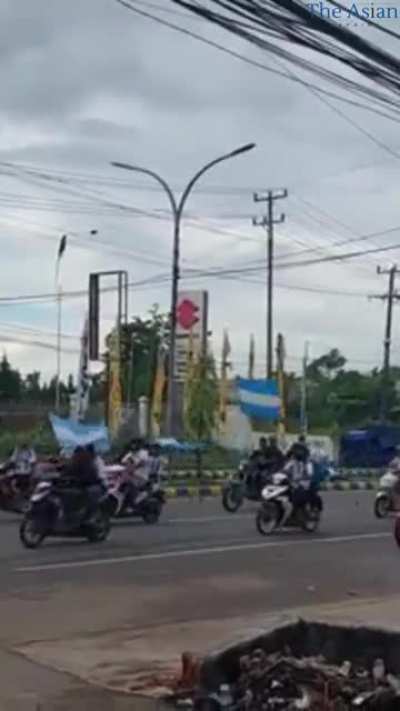 People come out to celebrate Argentina's victory against the Netherlands, in the city of Sorong, Indonesia