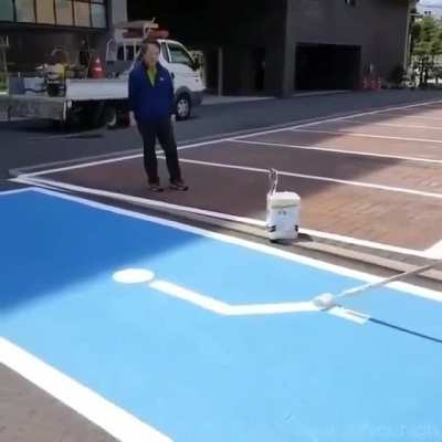 I had no idea these were done freehand, painting a disabled parking sign that is. Steady now.