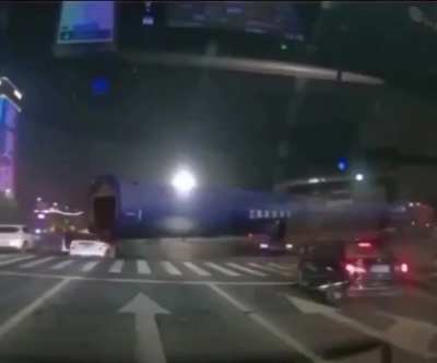 Car gets dragged along by a very large pipe