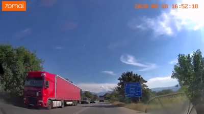 BMW driver crosses a double white line and barely escapes a collision