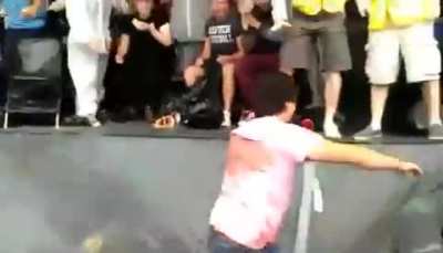 Dude looses his cool at a beer chugging contest and falls in the puke pit