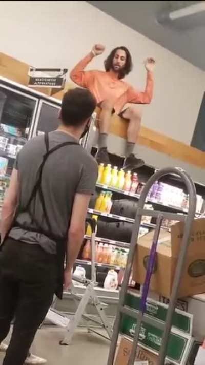 Grocery store doesn't want guy climbing up there.