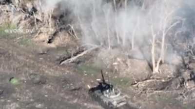 RU pov: Footage of two RU tanks assaulting an UA position. UA soldiers can be seen throwing grenades/explosive towards RU tank from a distance of 5-10 meters. It then shows the UA soldiers fleeing, with one soldier getting hit and wounded.