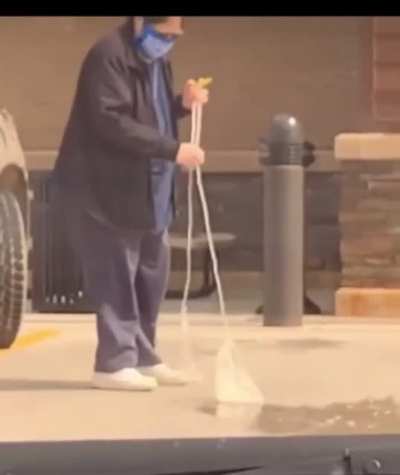 Lady slings bag of pee on the ground before putting it in the garbage