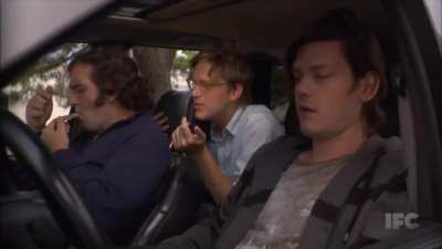 Footage of three guys smoking pot in a car when a squirrel jumps through the sunroof