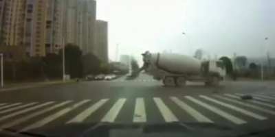 Cement truck slams into an ambulance, causing the patient to be ejected out the back of the ambulance