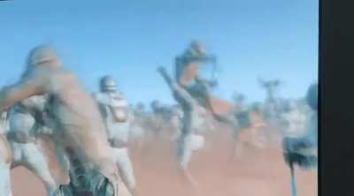 One of the Fremen in the background takes down their enemy in the most disrespectful way possible