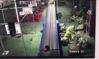 Standing on a conveyor belt.
