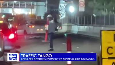 Man Dances With A Traffic Cone