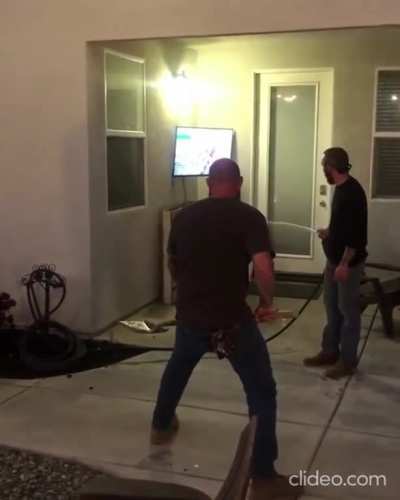 Three grown men try to flush out a pest