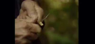 Man crafts a beautiful wind instrument from a stick