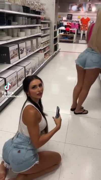 2 girls at a store.