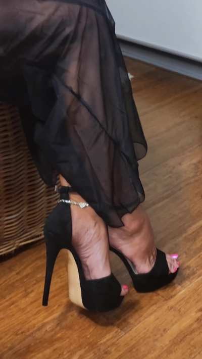Black stilettos and sheer black pants — the perfect conspiracy of power and temptation. Every step whispers authority, every glance dares desire to follow