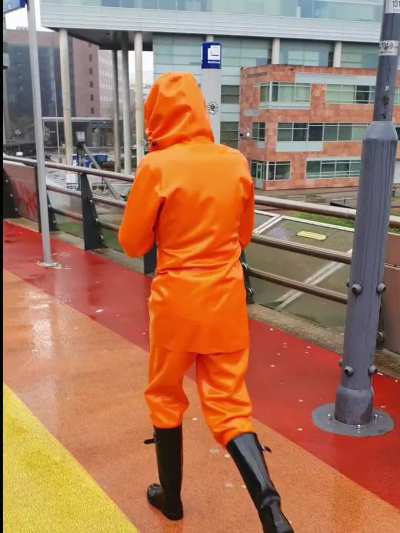 Latex rainwear at the train station